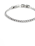A silver tennis bracelet with clear cubic zirconia stones, shown on a plain white background.