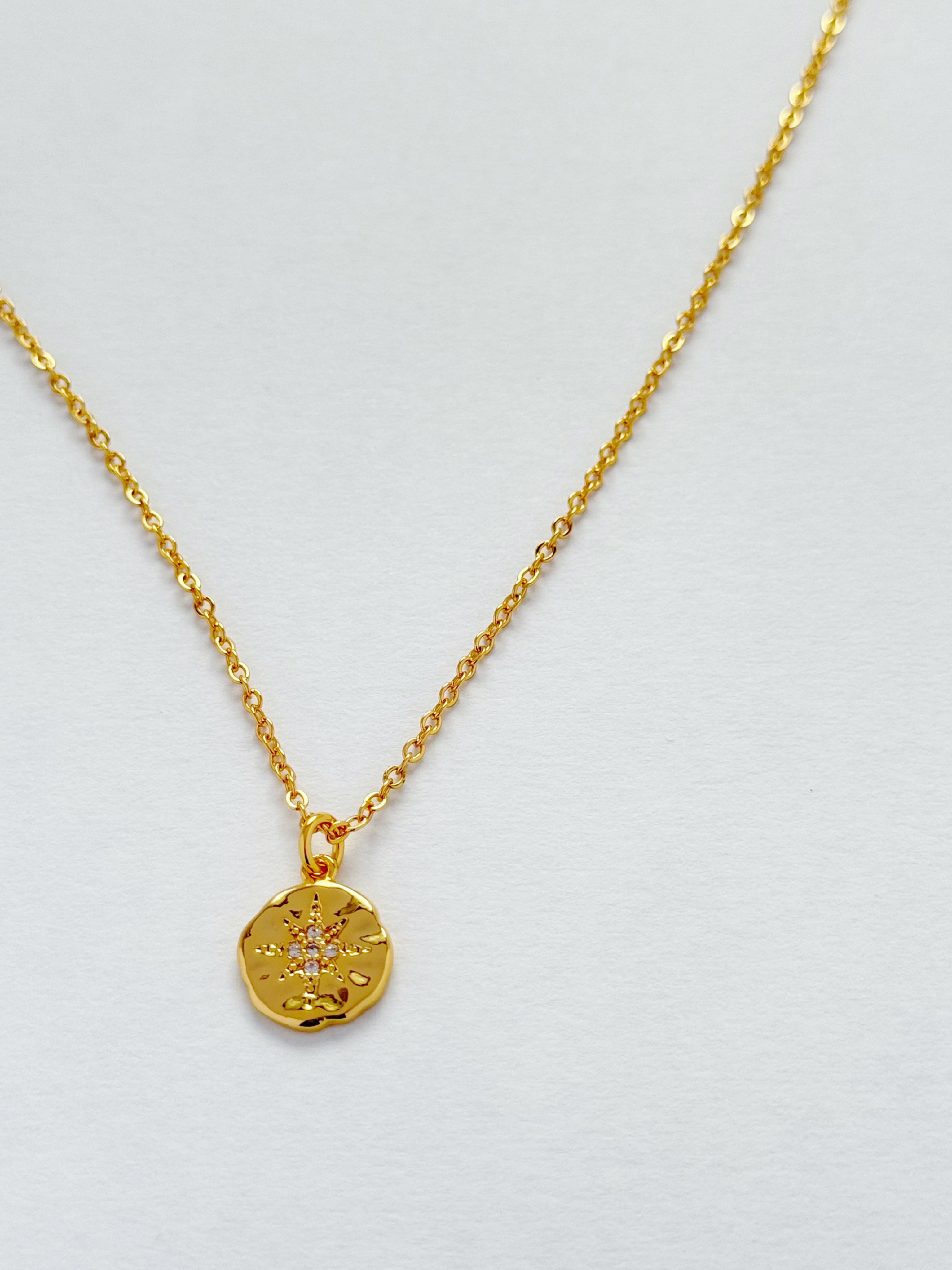 GOLD STARBURST DISC PENDANT NECKLACE